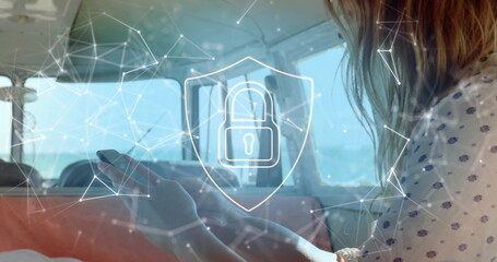 Poster - Image of network of connections with padlock over caucasian woman using smartphone