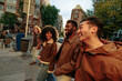 © bernardbodo - Happy multiracial friends walking and laughing together in the city
