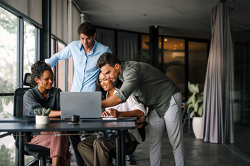 Fototapete - Multicultural professional businesspeople working together on research plan in boardroom.
