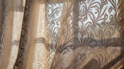 Aufkleber - Sunlight filters through sheer, patterned curtains, creating a play of light and shadow as they dance gracefully in the gentle breeze from an open window