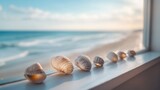 A window view of the ocean with a row of shells on the sill