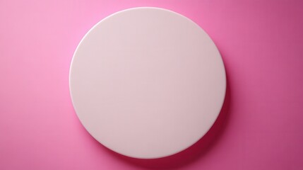 Poster - Close up view of a white, round object on a pink background. The object is smooth and appears soft, possibly a cosmetic puff or similar item. The pink background is a solid, even color.