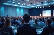 © Vadym - Corporate audience listens to presenter at conference event. Business people crowd at professional seminar. Speaker gives lecture in hall, discusses strategy, development, leadership, management,