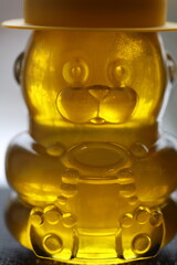 Aufkleber - A jar of a bear filled with honey.