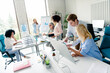 © deagreez - Young professionals collaborating in a modern office environment, multi-age