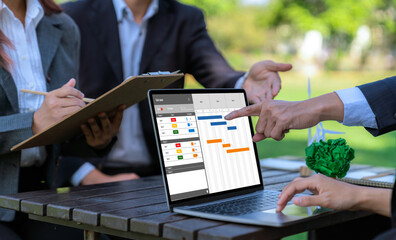 Poster - project planning software for brisk business project management on the computer screen showing timel