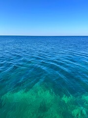 Wall Mural - blue turquoise sea and sunny clear sky.