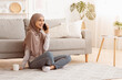 © Prostock-studio - Free Time Leisure. Joyful Muslim Girl In Headscarf Talking On Cellphone With Friend While Relaxing At Home With Coffee, Copy Space