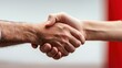 © Sutat - Close up Sandy Handshake Against Blurred Background