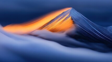 Wall Mural - a mountain shrouded in cloud, bathed in an orange glow emanating from its summit in the distance
