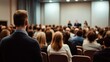 © Pinit - Audience observing a speaker at a conference hall.