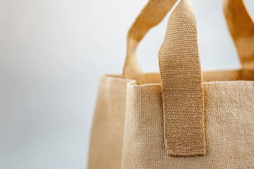 Poster - Simple jute bag displayed against a light background showcasing its eco-friendly design and texture
