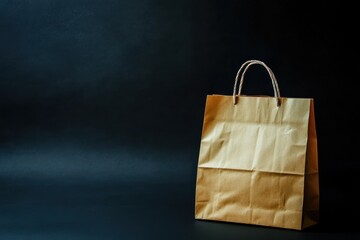 Poster - Brown paper bag placed on a dark surface with a minimalistic backdrop, emphasizing simplicity and functionality