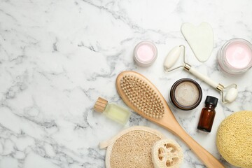 Wall Mural - different body care products on white marble table, flat lay. space for text