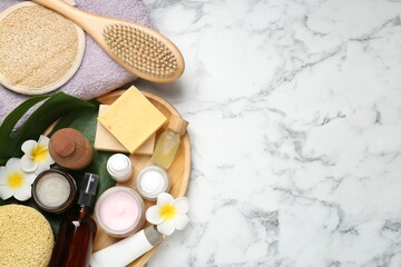 Wall Mural - flat lay composition with different body care products on white marble table. space for text