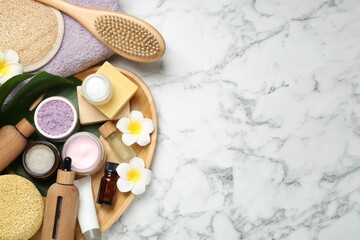 Wall Mural - flat lay composition with different body care products on white marble table. space for text
