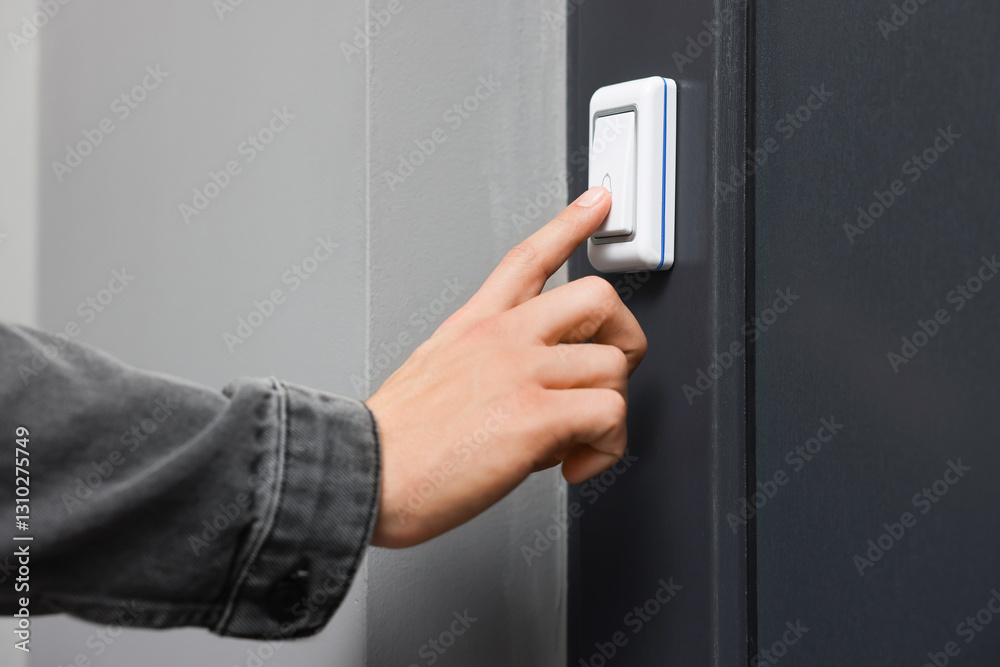 Man ringing doorbell of his friends apartment, closeup Stock Photo ...
