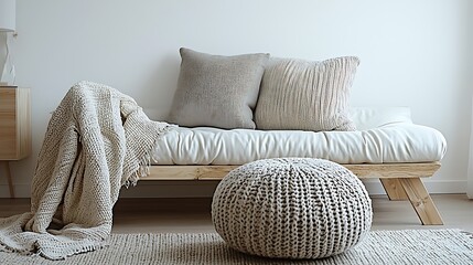 Poster - Minimalist Light Wood Futon with Knitted Throw and Pouf