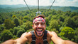 © ARTem - Thrilled man ziplining over lush rainforest canopy, enjoying adventure and freedom. Exciting outdoor experience concept.