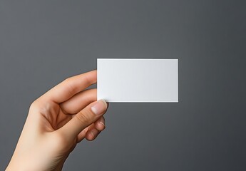Aufkleber - Person Holding Blank Business Card Against Dark Gray Background for Branding Purposes : Generative AI