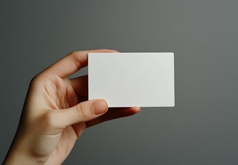Leinwandbilder - Minimalist blank business card held in a hand on a plain background for branding concepts : Generative AI