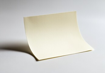 Fototapete - Elegant cream colored paper sheet displayed in artistic wave form showcasing texture and simplicity : Generative AI