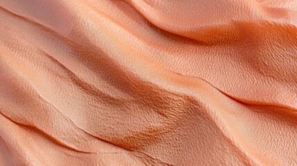 Poster - Textured Orange Fabric with Waves and Soft Ripples Creating a Vibrant Visual Effect