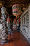 Ancient Clan House with beautiful stone curving. Chinese words on lantern: Family house, healthy and weath