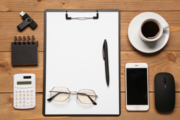 Wall Mural - clipboard, cup of coffee and computer mouse on wooden background
