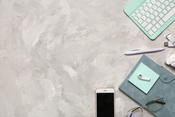 Wall Mural - computer keyboard, notebook, phone and flash drive on grunge background