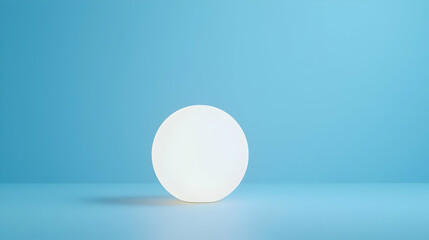 Poster - Soft Glowing Sphere on Minimalist Blue Background for Artistic Use
