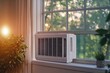 © EUT - White window air conditioner unit installed in a window. Ideal for illustrating home cooling solutions, energy efficiency, or summer comfort.