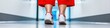 © Ryzhkov - Minimalist Healthcare Mobility Dynamic Red-Accented Ergonomic Footwear Showcasing Patient Comfort and Clinical Wellness Innovation