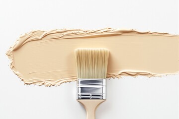 Poster - Paintbrush with beige paint stroke on white background.