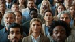 © Oulaphone - A diverse crowd of people attentively facing forward, showcasing a mix of ages, ethnicities, and genders in a formal setting.