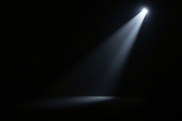 Poster - Spotlight beam in dark space creating a focused lighting effect.