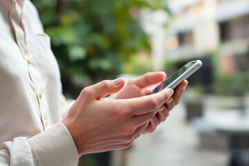 Poster - Person holding smartphone in hand.