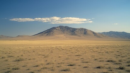 Poster - A vast desert with only a single sand dune under a pale blue sky