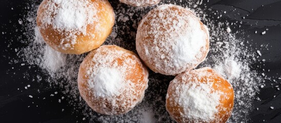 Aufkleber - Delicious homemade doughnuts dusted with powdered sugar arranged on a dark surface with ample white powdered sugar around them