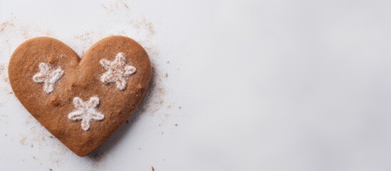Poster - Heart-shaped gingerbread cookie decorated with white icing flowers positioned on the left side of a light grey background for Valentine's Day.