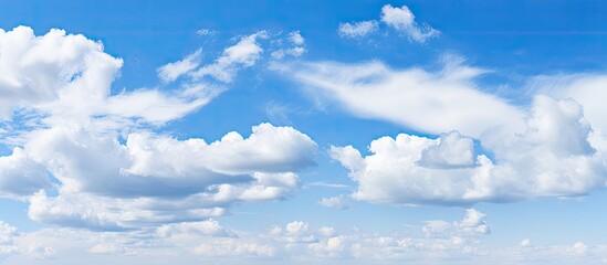 Poster - Vast blue sky with fluffy white clouds scattered throughout creating an ideal blank space for text or design use in a serene atmosphere