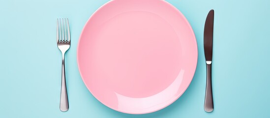 Aufkleber - Minimalistic pink plate with shiny silver fork and knife on a soft turquoise background, styled for modern dining presentations.