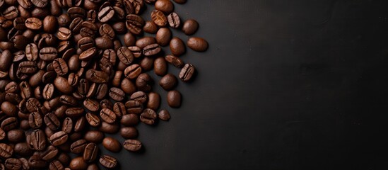 Aufkleber - Top view of dark roasted coffee beans scattered on the left side of a black concrete background with ample negative space for text on the right