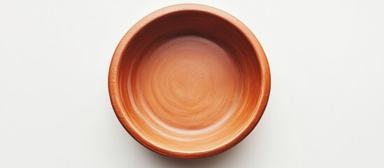 Aufkleber - Round clay baking pan viewed from above, orange-brown color, minimalistic design, centered on a clean white background, highlighting its smooth texture.
