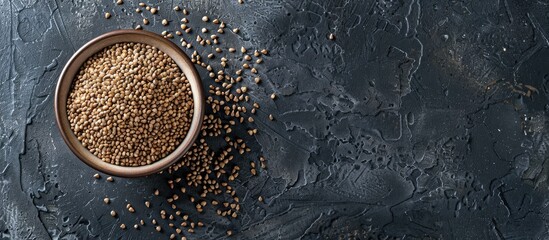 Aufkleber - Bowl of buckwheat grains on a dark textured concrete surface with scattered grains in earthy tones creating a rustic culinary vibe