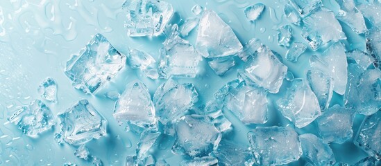 Leinwandbilder - Crushed ice scattered on a light blue background with clear copy space for text positioned centrally in the composition for visual appeal.