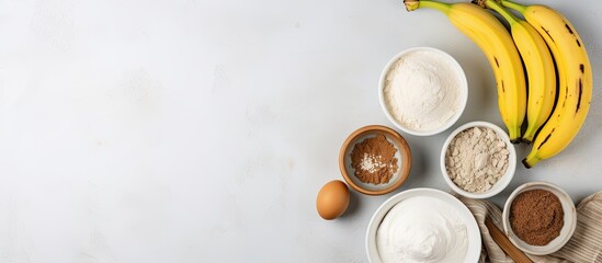 Poster - Ingredients for banana bread arranged in bowls on light gray surface with ripe bananas and ample copy space for text on the right side