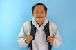 © Lailar Studio - Asian male student smiling wearing hoodie and black backpack