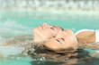 © Antonioguillem - Couple or friends relaxing floating in spa pool