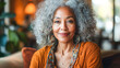 © Melinda Nagy - black woman with curly grey hair on sofa